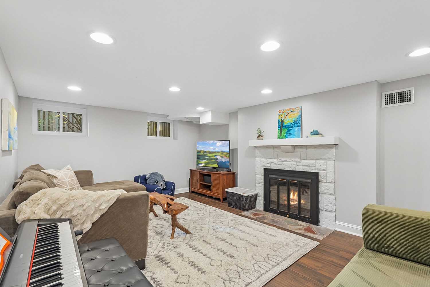 35 60 Wellington Ave - Lower level rec room with wood-burning fireplace - The Elizabeth Winterbottom Team