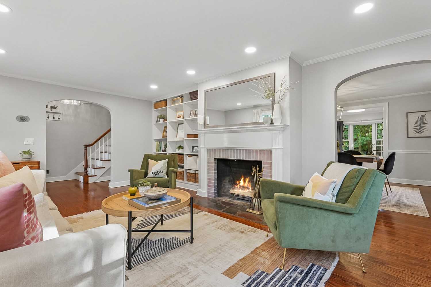 8 60 Wellington Ave - Living room with wood-burning fireplace - The Elizabeth Winterbottom Team